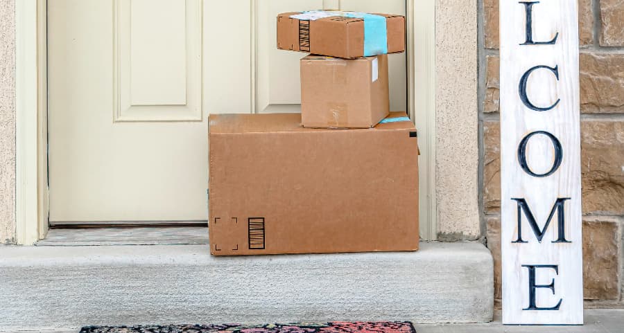 Boxes by the door of a residence with a welcome sign in Richmond